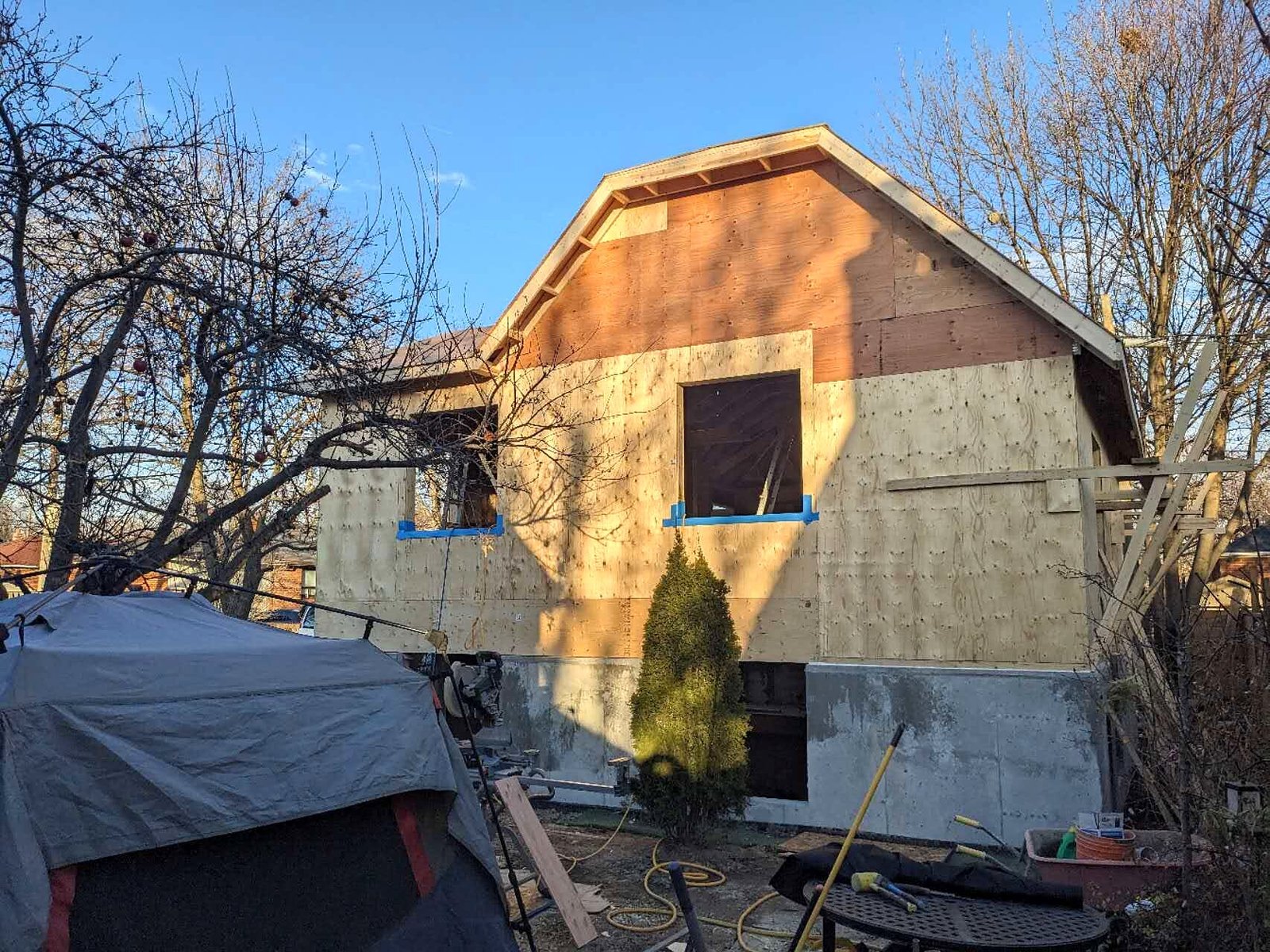 Laneway house exterior with sheathing and window openings