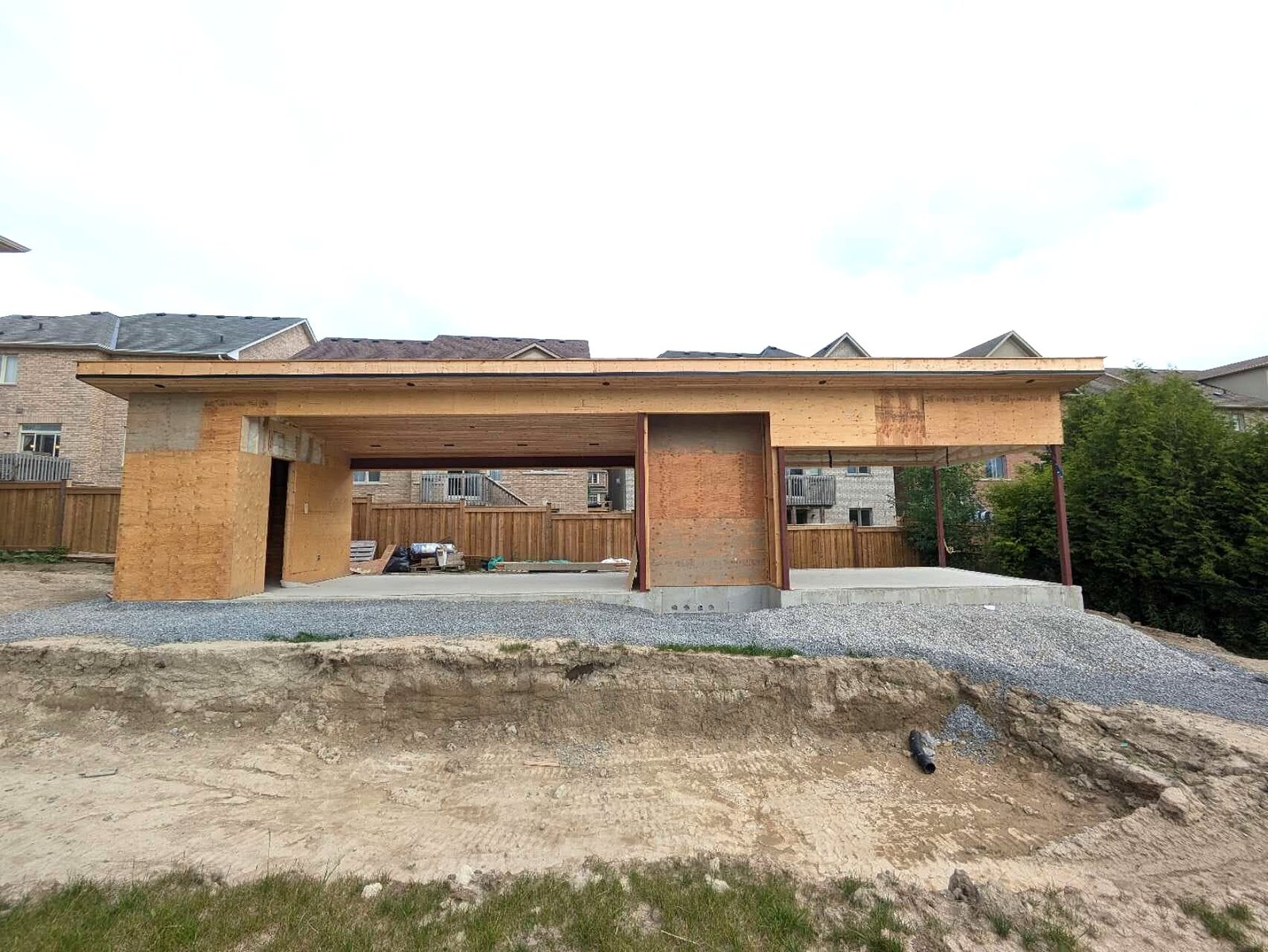 Pool cabana front view with gravel and concrete pad
