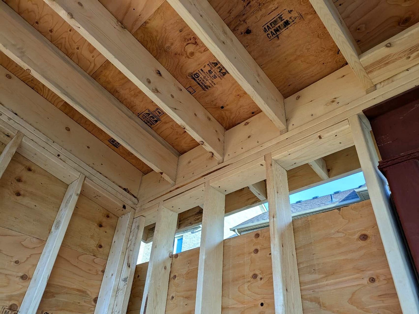 Pool cabana framing under the roof beams